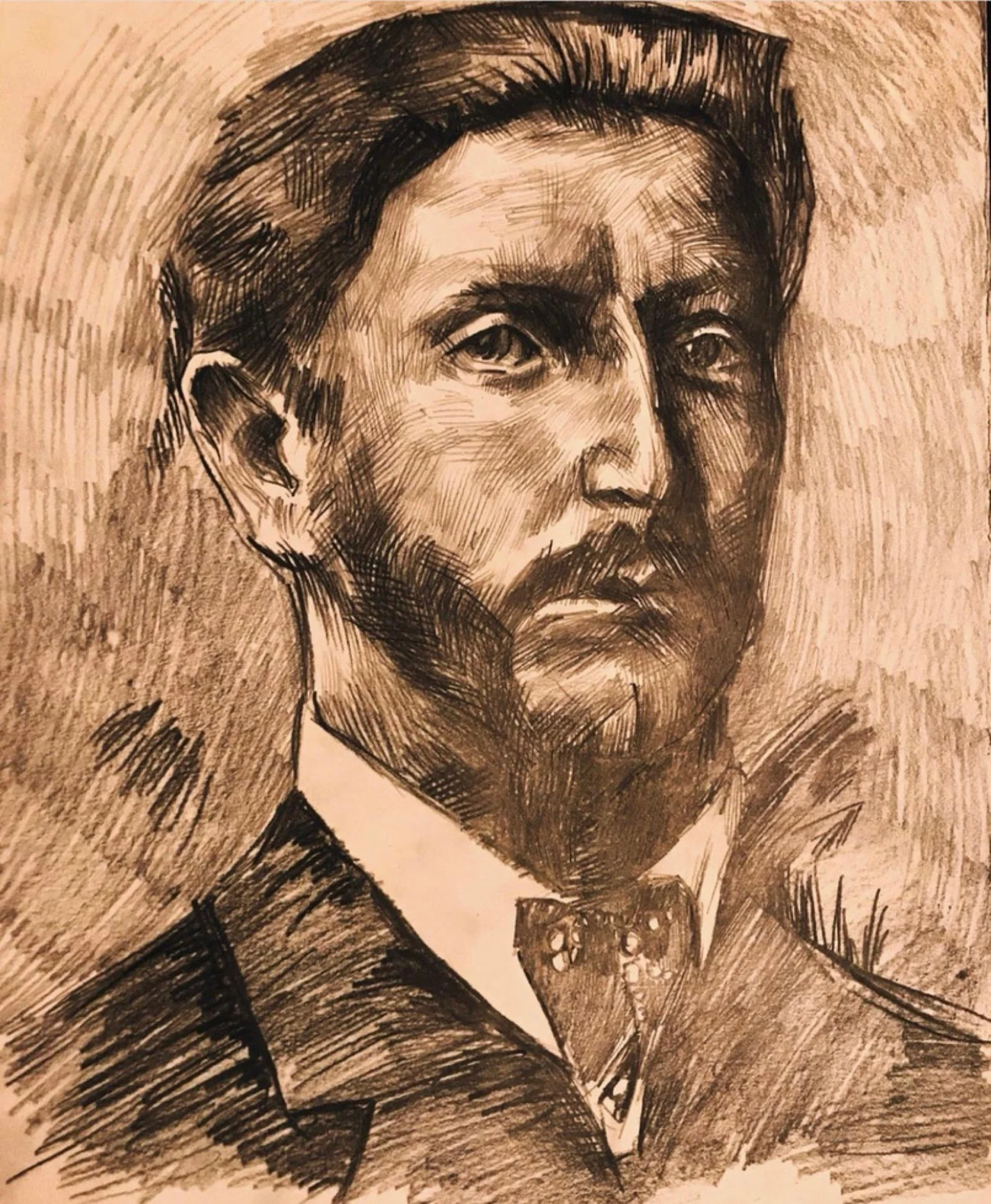 Rysunkowy portret brodatego mężczyzny w muszce, w ciepłej sepii